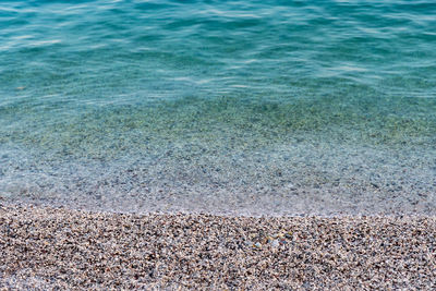 High angle view of pebbles on beach