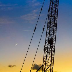 Low angle view of electricity pylon