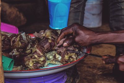 Close-up of hand holding meat