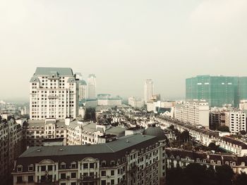 High angle view of buildings against clear sky