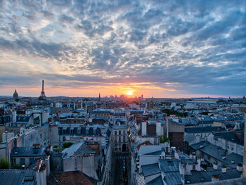 High angle view of city buildings during sunset