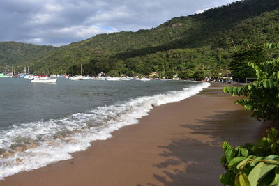 Scenic view of beach against sky