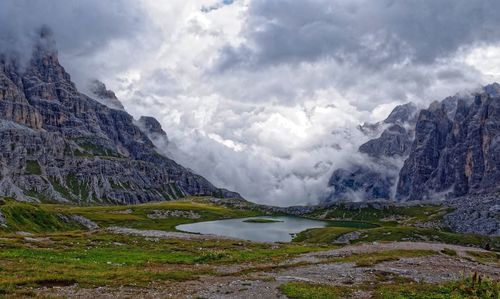 Scenic view of lake and mountains against sky