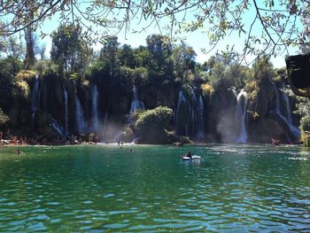 Panoramic view of waterfall in river