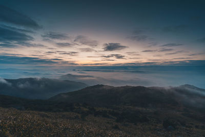 Scenic view of mountains against sky during sunset