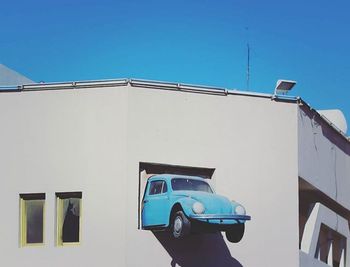 Low angle view of building against clear blue sky