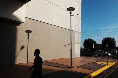 Silhouette of man standing on street