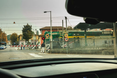 View of street seen through car windshield