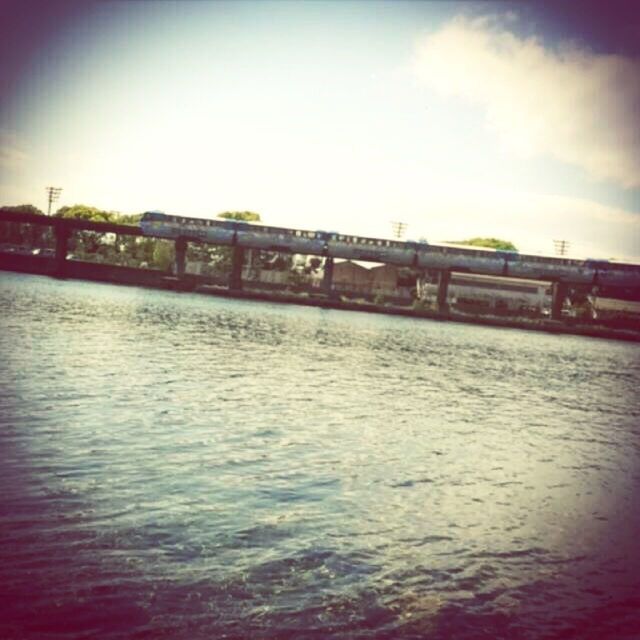 water, built structure, waterfront, architecture, bridge - man made structure, sky, connection, bridge, river, rippled, auto post production filter, tranquility, nature, transportation, outdoors, tranquil scene, cloud - sky, sea, reflection, engineering