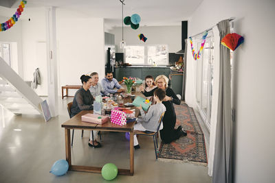 High angle view of family enjoying birthday party at home