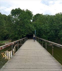 Footbridge with trees in background