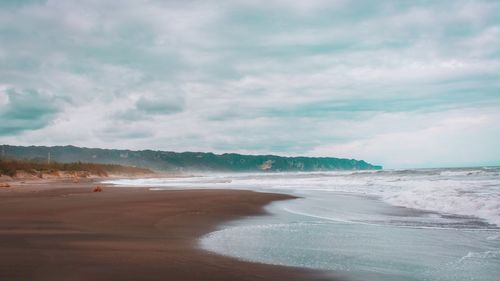 Scenic view of beach against sky