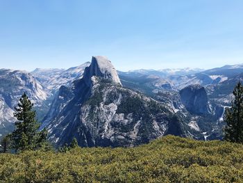 Scenic view of mountains against clear blue sky