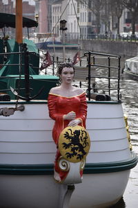 Woman standing in boat