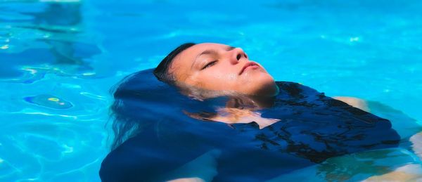 Girl swimming in pool