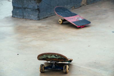 Broken skateboard on the asphalt street. extreme sport, accident