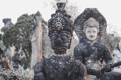 Statue of buddha against building