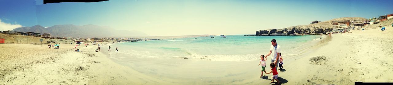 beach, sand, sea, shore, water, vacations, horizon over water, leisure activity, large group of people, sky, scenics, sunlight, beauty in nature, incidental people, lifestyles, summer, nature, tourist, enjoyment