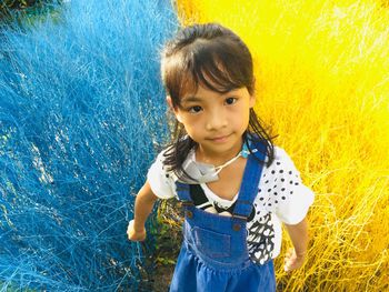 Portrait of cute girl standing outdoors