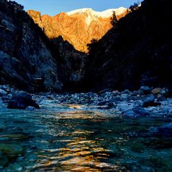 Scenic view of river against mountains