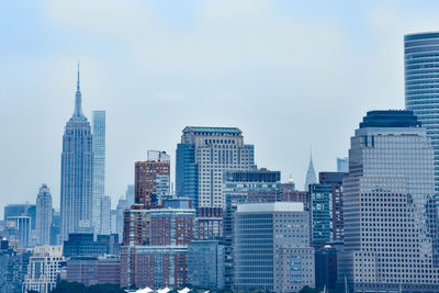 Skyscrapers in city against sky