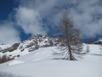 Scenic view of snow covered mountain against sky