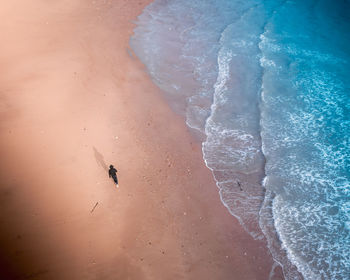 Full length of man running at beach