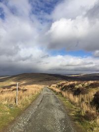 Scenic view of farm against sky