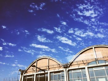 Low angle view of ferris wheel against sky