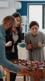 Side view of business colleagues working at restaurant