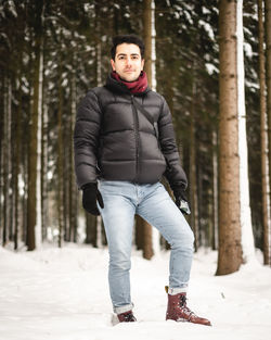 Portrait of man standing in snow