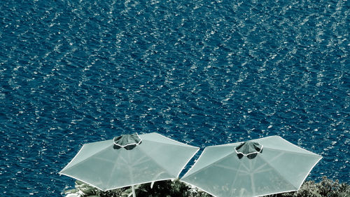 High angle view of sea against blue sky