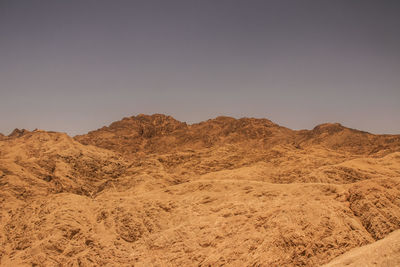 Scenic view of desert against clear sky