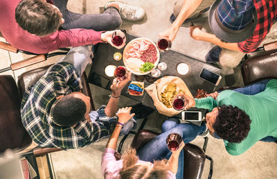 High angle view of friends having food at restaurant