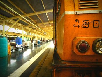 Train at illuminated railroad station