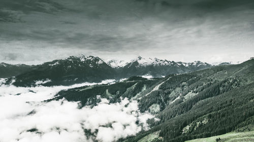 Scenic view of snowcapped mountains against sky