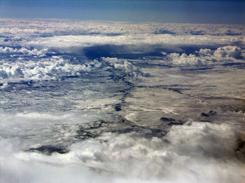 Aerial view of landscape against sky during winter