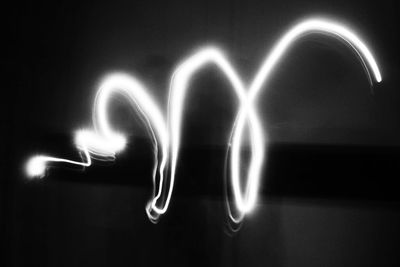 Close-up of love over black background