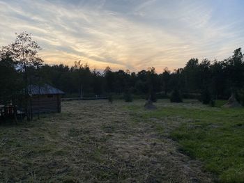 Scenic view of field against sky during sunset