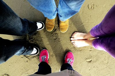 Low section of man standing on tiled floor