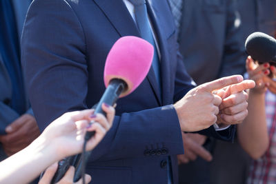 Close-up of people holding hands