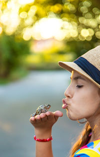 Close-up of young woman drinking water