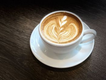 Close-up of cappuccino on table