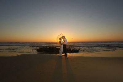 Scenic view of calm sea at sunset