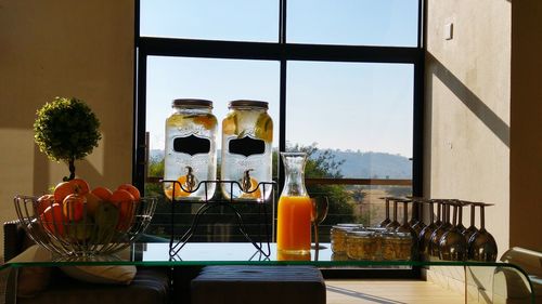 Close-up of bottles on table against window