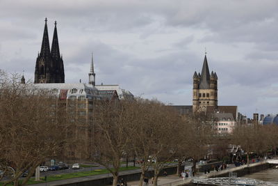 View of dom in cologne against cloudy sky