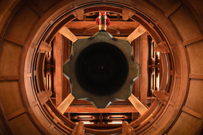 Close-up of electric lamp hanging from ceiling at home