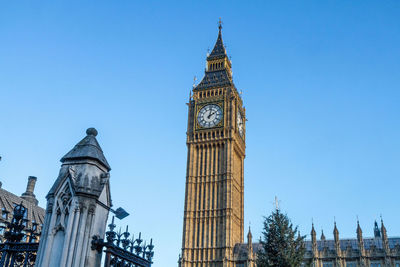 Low angle view of clock tower against sky