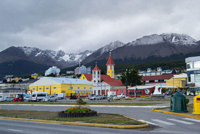 Houses and mountains against sky