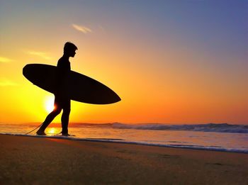 Silhouette of people on beach